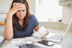 woman looking at her bills
