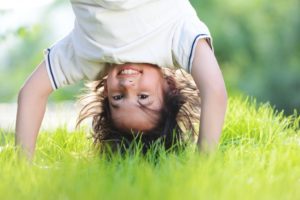 child playing on the grass
