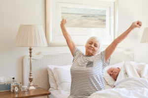 old woman waking up in the morning