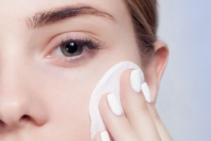 woman removing makeup