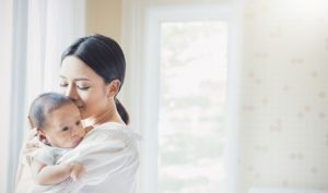 new mom carrying first bonr ddaughter