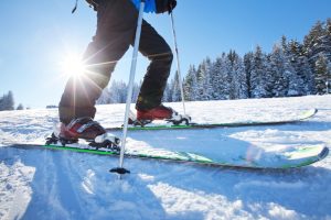 man skiing down slope