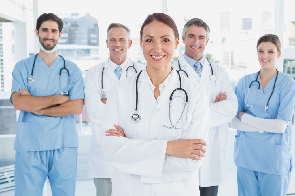 medical professionals crossing their arms while posing for a camera