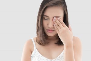 a person with aching eye