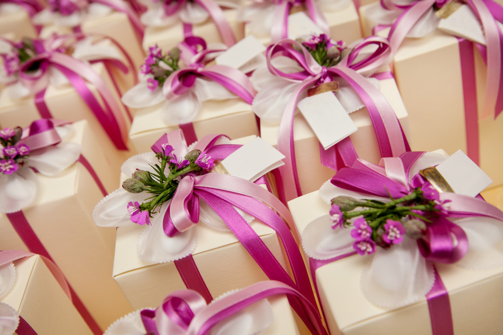 wedding gift for guests with purple and white ribbon