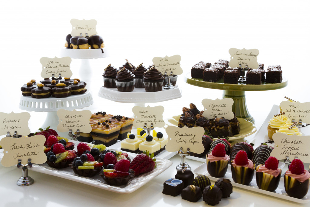 Various chocolate desserts on white background