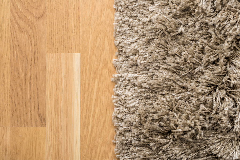 A fluffy brown rug on a wood floor
