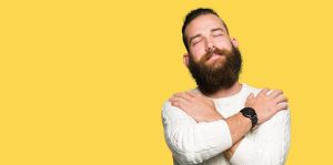 a man embracing himself