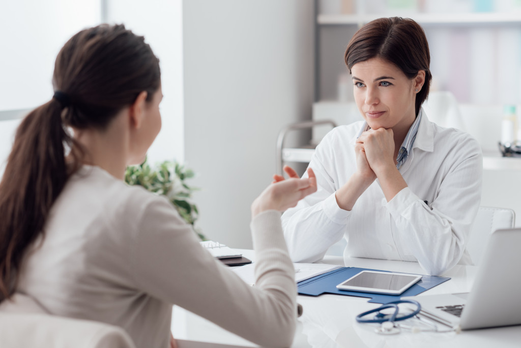 woman seeking medical advice to a doctor