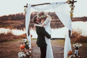 A couple kissing after their wedding