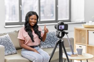 happy smiling african american female video blogger